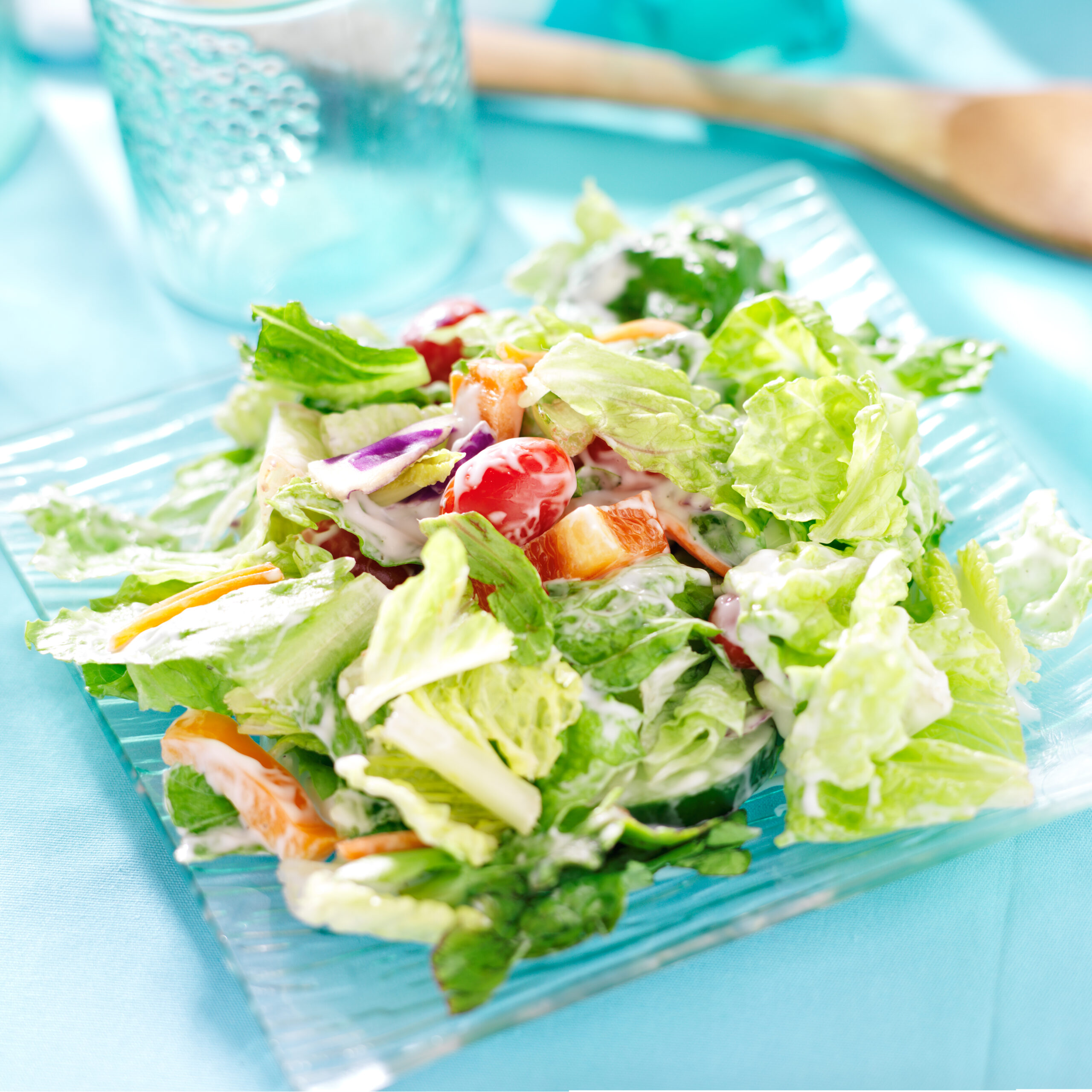 Garden,Salad,With,Fresh,Vegetables,And,Ranch,Dressing,On,Glass
